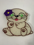Otter w/hibiscus flower